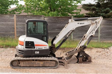 how much is a mini bobcat excavator|smallest bobcat excavator.